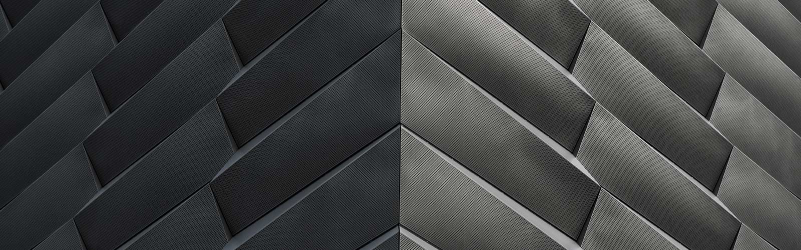 Abstract close-up of diagonal perforated metal panels meeting at a sharp corner