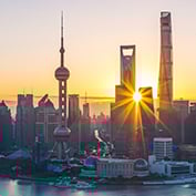 Sunrise over the Shanghai skyline, symbolizing growth in emerging markets.