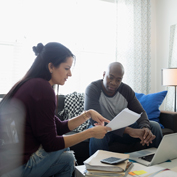 two people consulting over a document